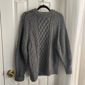 Chunky gray cable-knit sweater